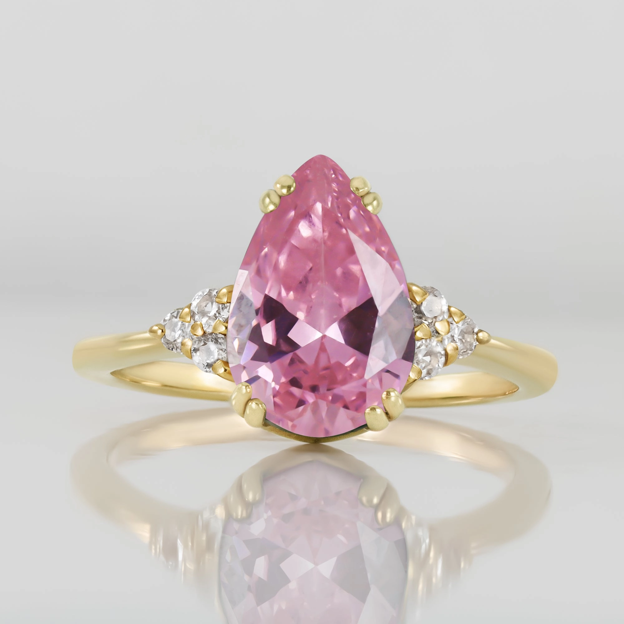 October Birthstone Pear-Shaped Rose Quartz Ring with Clear Quartz Accents