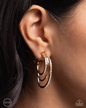 Triad Trek - Gold - White and Peach Rhinestone Paparazzi Clip-On Hoop Earrings